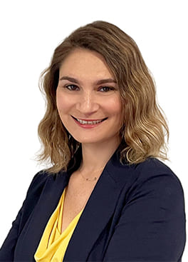 A photograph of Hayley Cooper, Senior Program Manager of PCI-GS